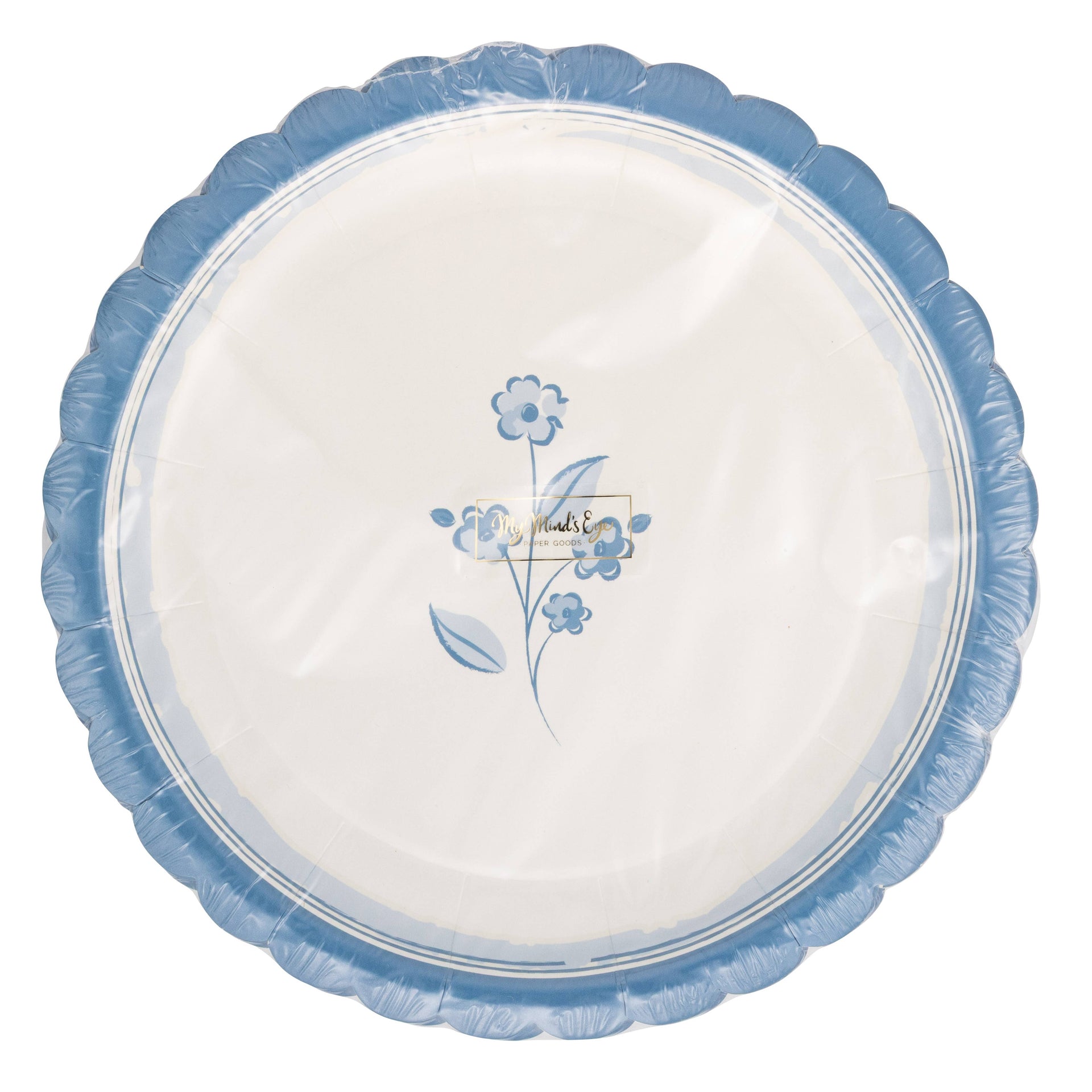 Round white plate with blue floral design and scalloped edge on a white background