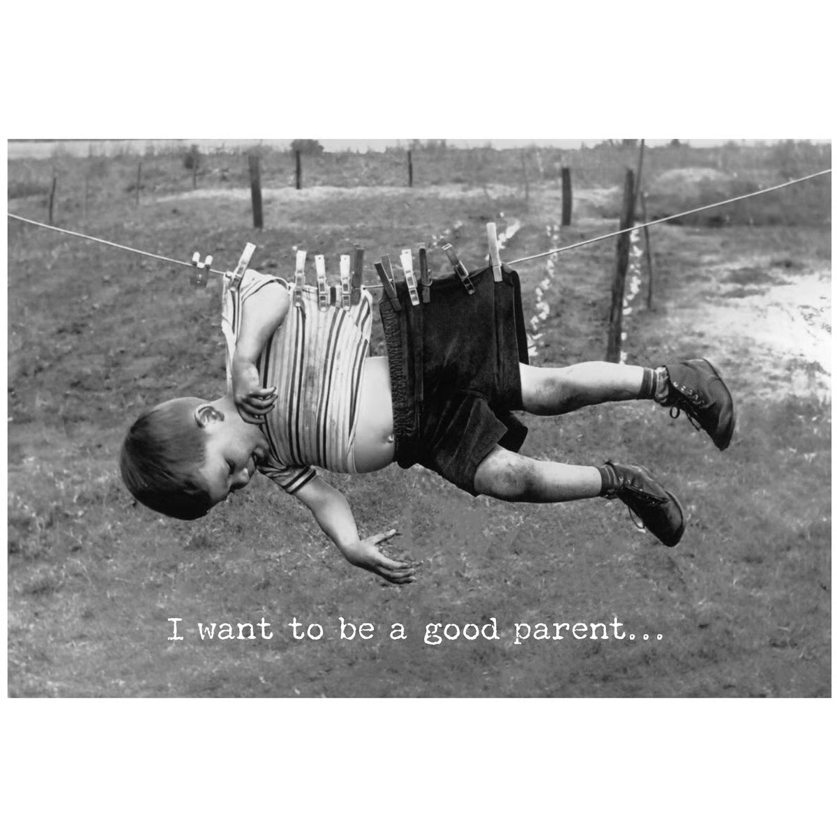 Black and white greeting card featuring a vintage photo of a child hanging from a clothesline with text 'I want to be a good parent'.