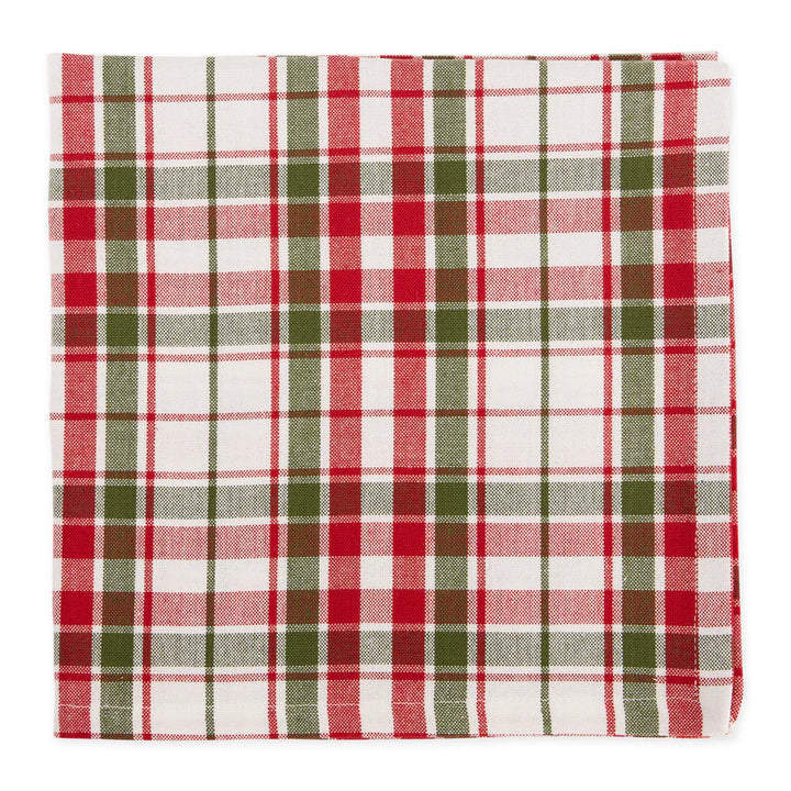 Plaid napkin with red, green, and white pattern on a white background