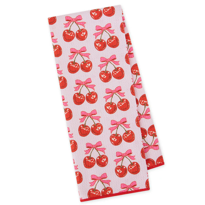 Kitchen towel with cherry and bow pattern on a white background