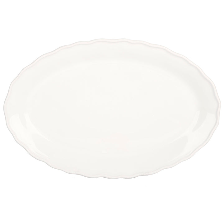 White platter with ruffle edge on a white background