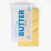 Book titled 'The Butter Book' with a yellow cover on a white background
