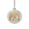 Decorative hanging ball with nativity scene inside on a white background