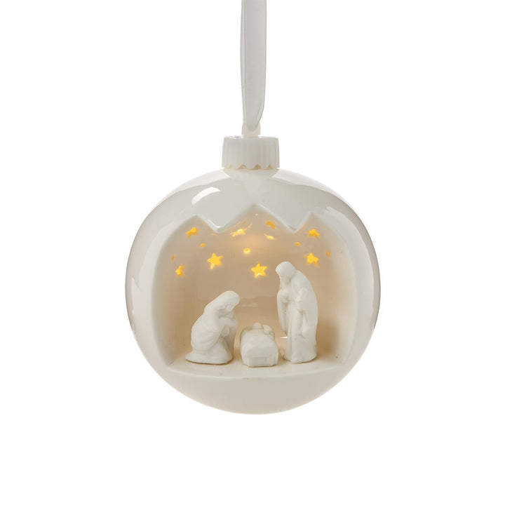 Decorative hanging ball with nativity scene inside on a white background