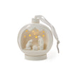 Decorative ornament with a nativity scene inside a glass ball on a white background