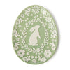 Decorative plate with white floral and rabbit design on a white background