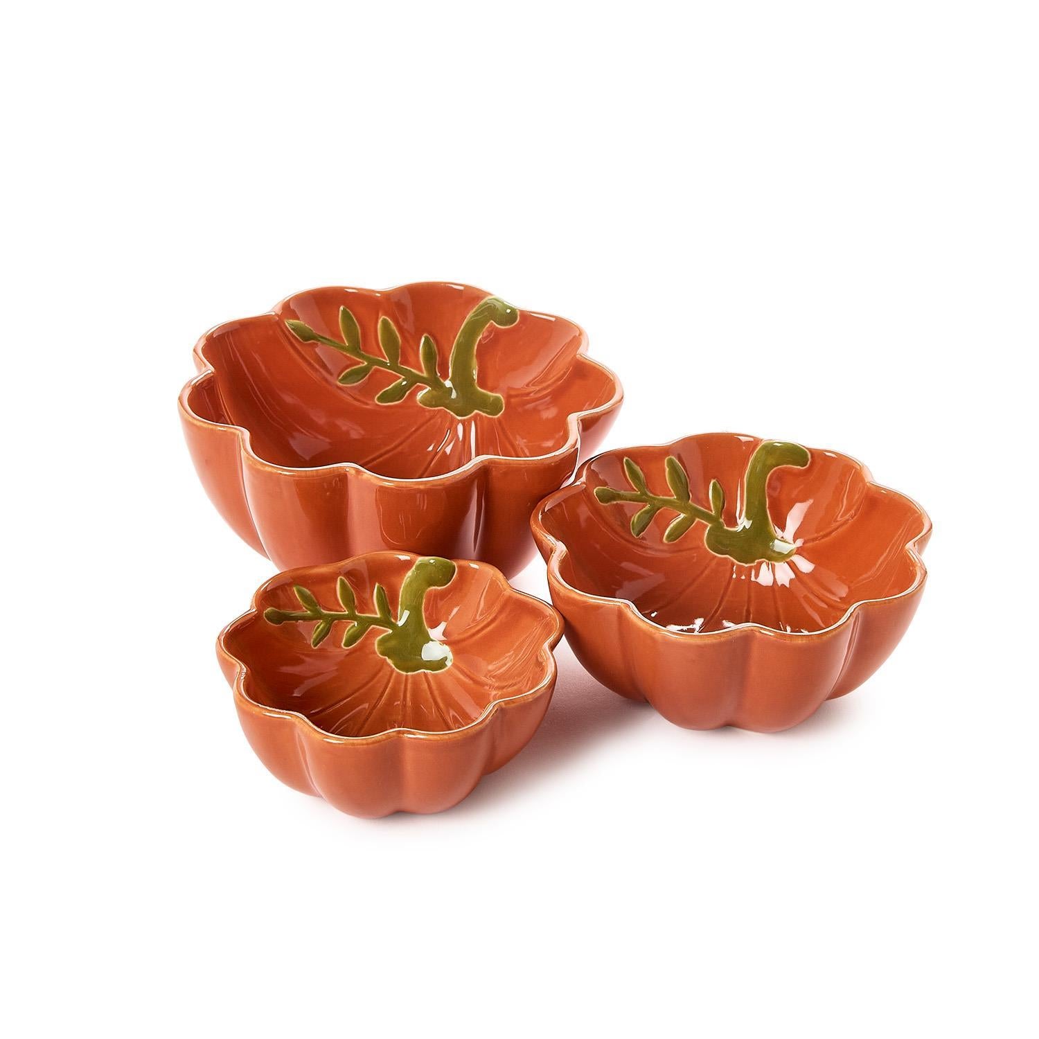 Three pumpkin-shaped bowls with leaf designs on a white background