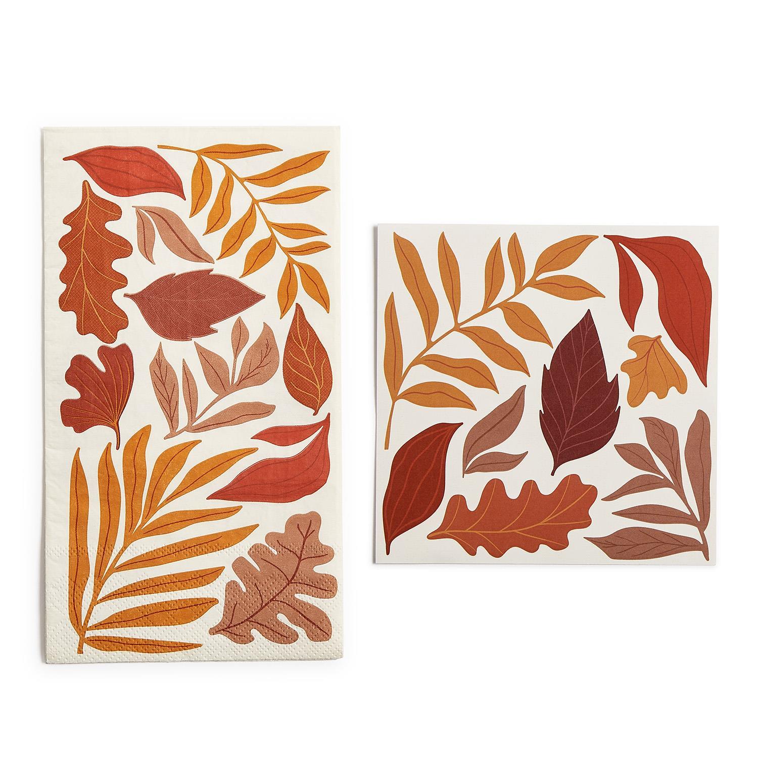 Two decorative paper napkins with autumn leaf patterns on a white background