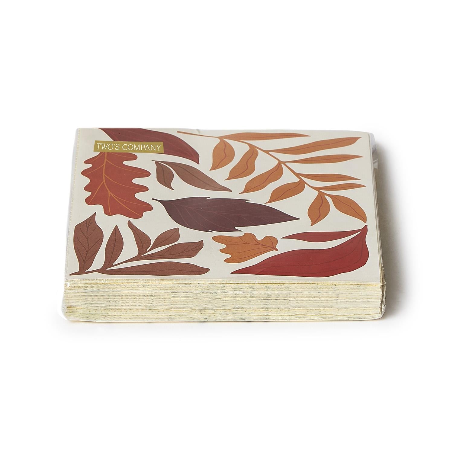Stack of paper napkins with leaf pattern on a white background