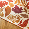Autumn leaf patterned table runner on a wooden surface