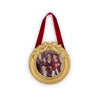Decorative gold frame with a family photo inside, hanging on a white background