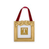 Decorative gold frame with a red ribbon and holly leaf embellishments on a white background