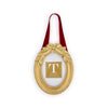 Decorative gold frame with a red ribbon and holly leaf embellishments on a white background