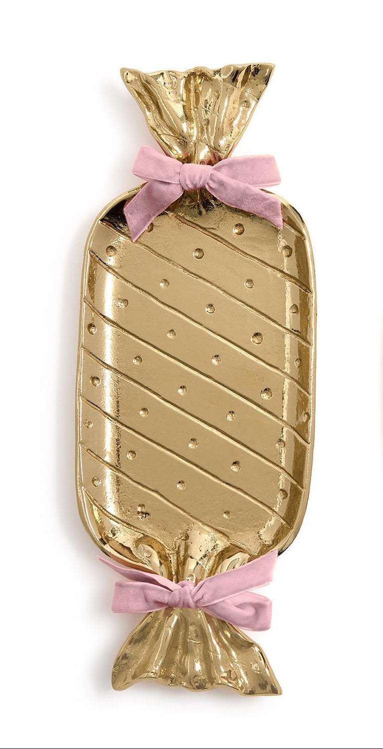 Gold candy-shaped tray with pink ribbons on a white background