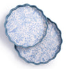 Two blue and white patterned plates stacked on a white background