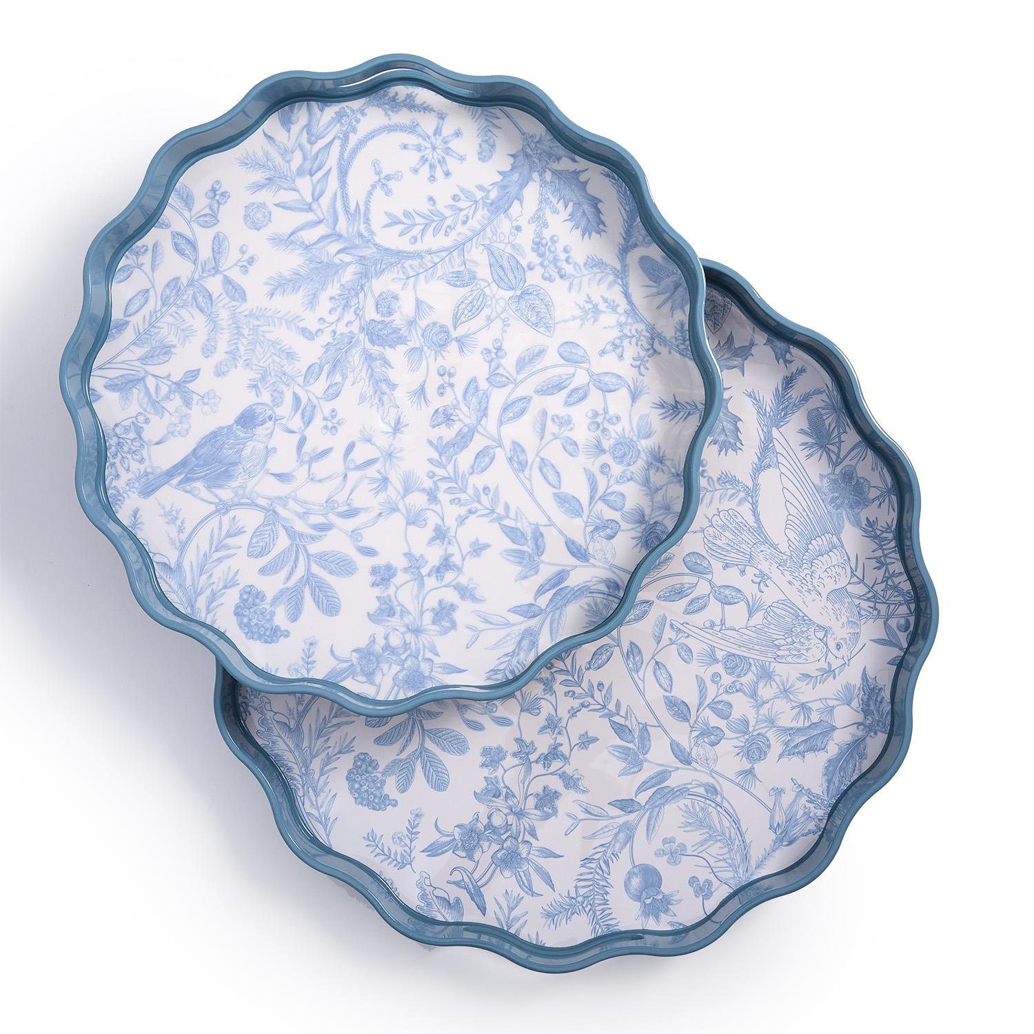 Two blue and white patterned plates stacked on a white background