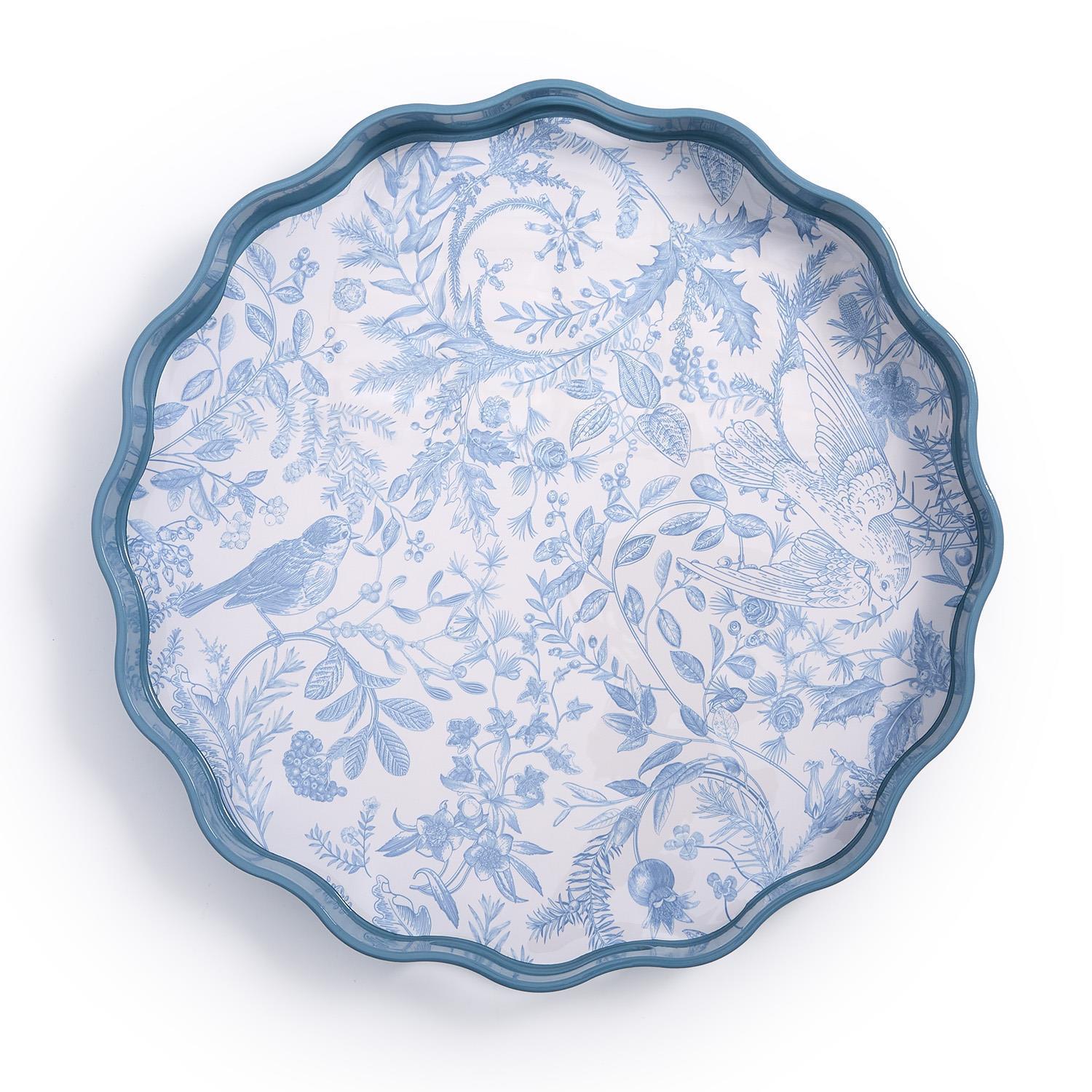 Decorative plate with blue floral and bird pattern on a white background