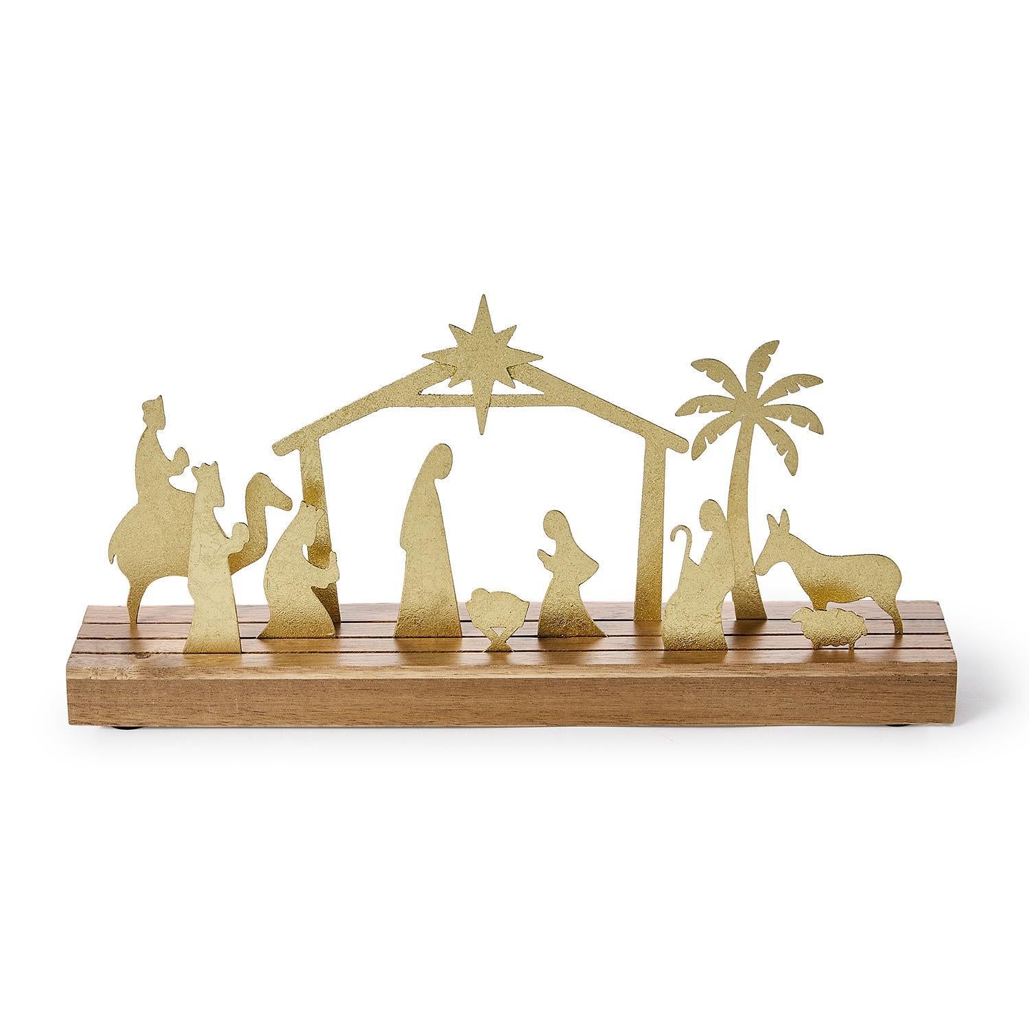 Gold nativity scene on a wooden base with a white background