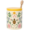 Decorative honey jar with floral design and bee illustration on a white background