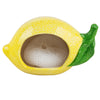 Lemon-shaped container with a green leaf on a white background