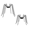 Two black metal spider candle holders on a white background