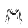 Black spider-shaped candle holder on a white background