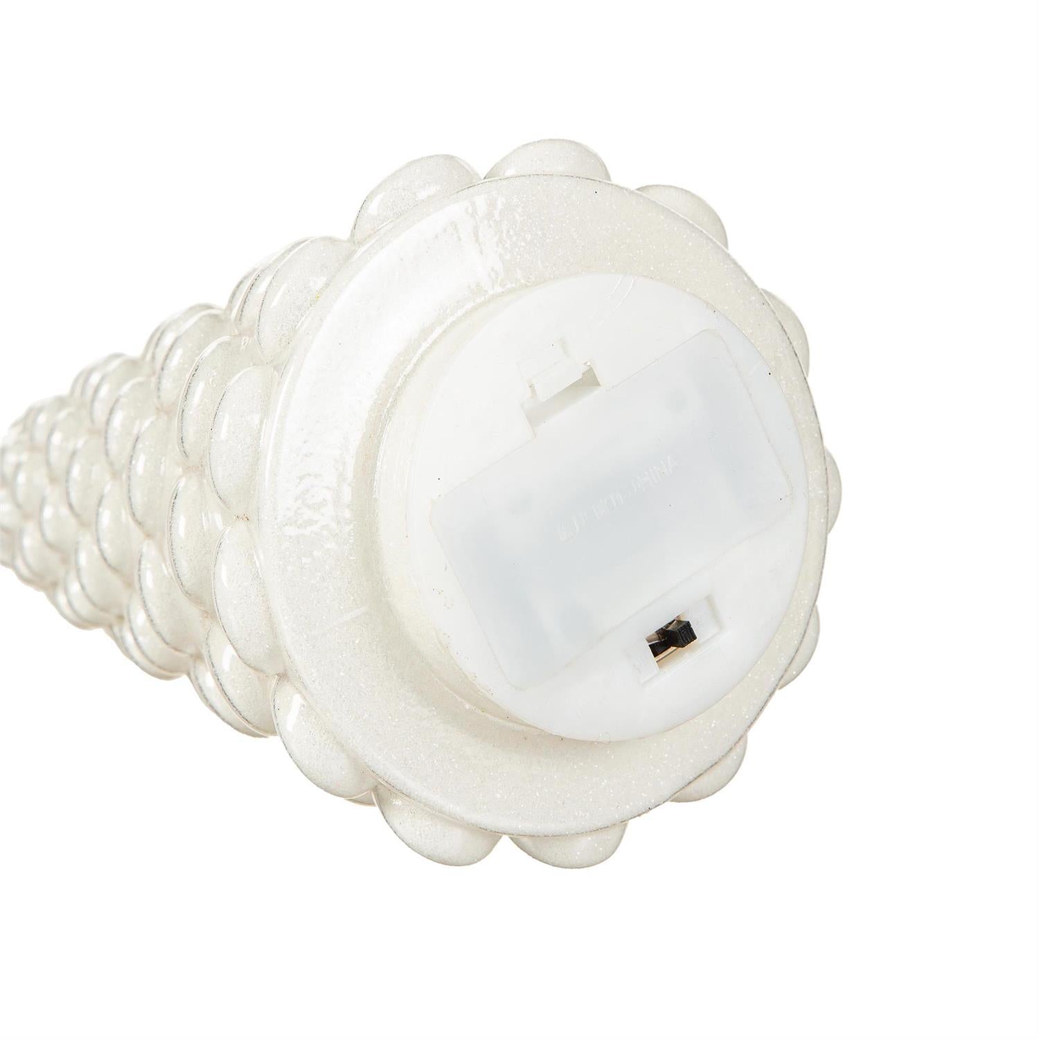 White Christmas tree bottom showing the on/off switch on a white background