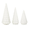 Three white Christmas tree figurines of different sizes on a white background