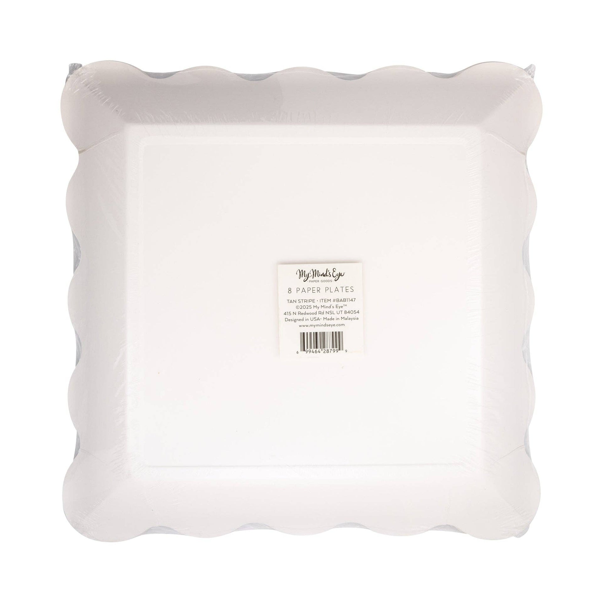 Bottom view of paper plates with scalloped edge on a white background