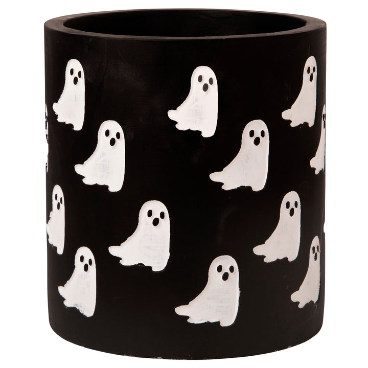 Black cylindrical utensil crock with white ghost patterns on a white background