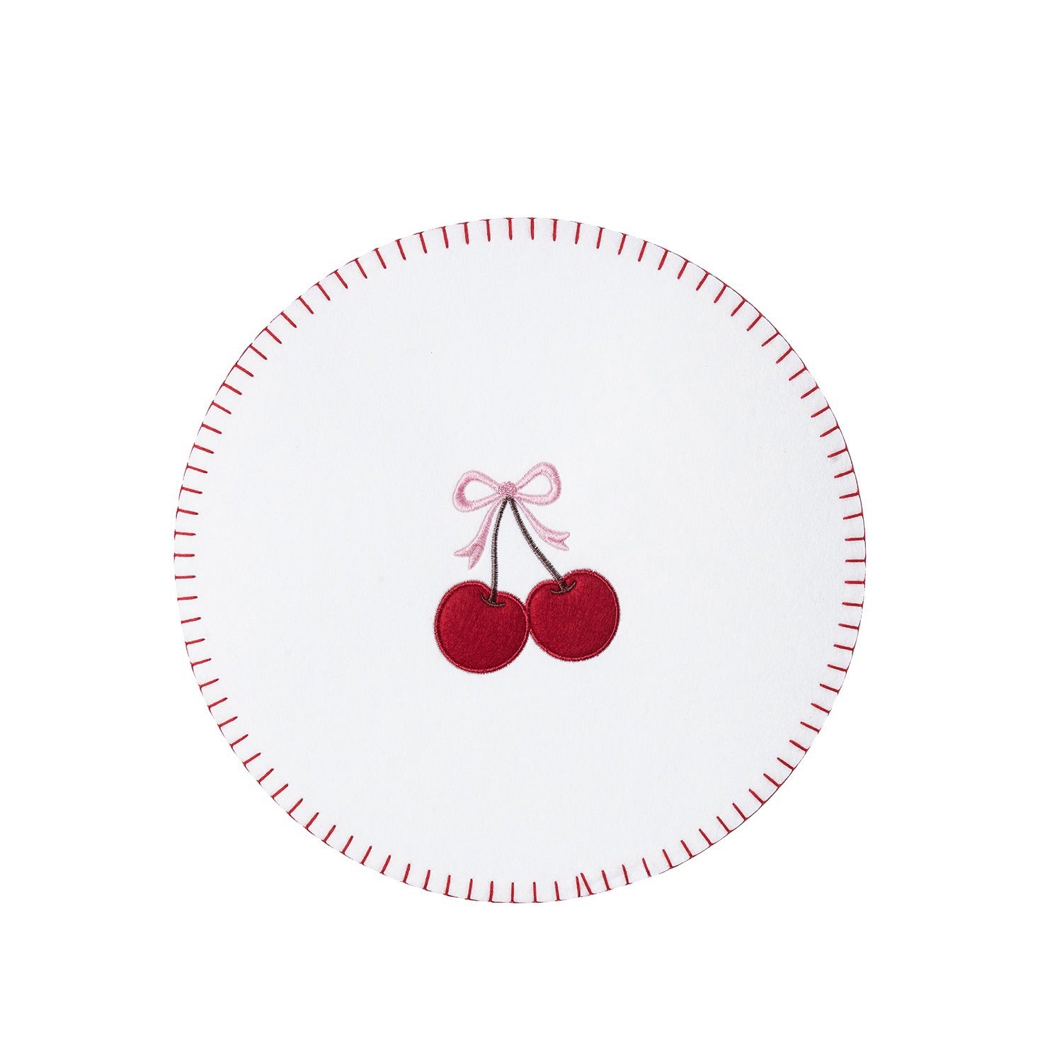 A white circular coaster with a red dashed rim and a central embroidered design of two red cherries tied with a pink bow.