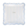 Decorative plate with blue border and striped center on a white background