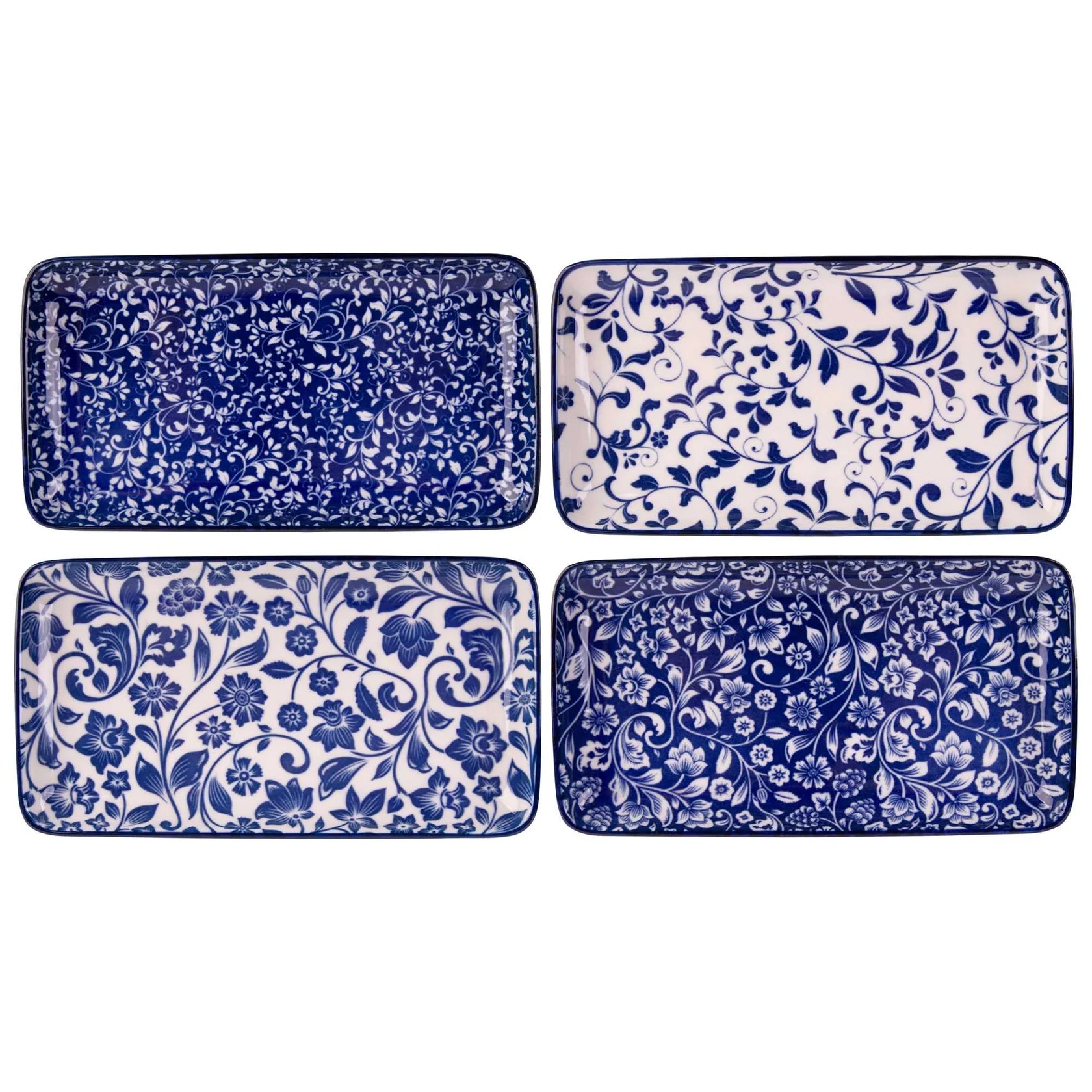 Set of four blue and white patterned trays on a white background