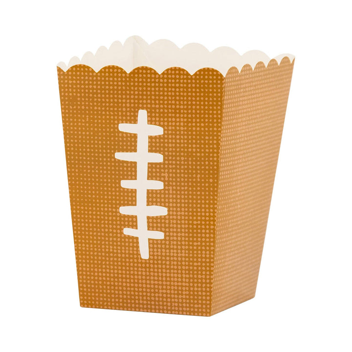 Football-shaped treat box with a scalloped edge on a white background