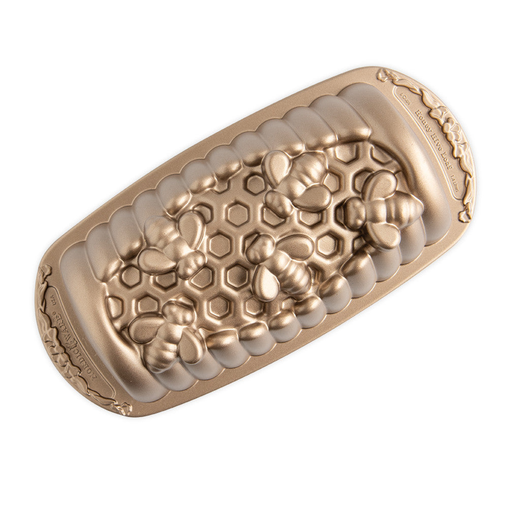 Bronze colored honeycomb textured loaf pan on a white background
