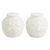Two white salt and pepper shakers with floral pattern on a white background