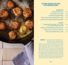Butter-basted scallops in a pan with Beurre Blanc recipe on the side.