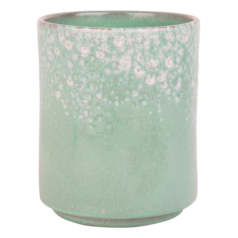 Aqua blue utensil crock with white accents on a white background
