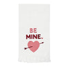 White towel with pink heart and text 'BE MINE' on a white background
