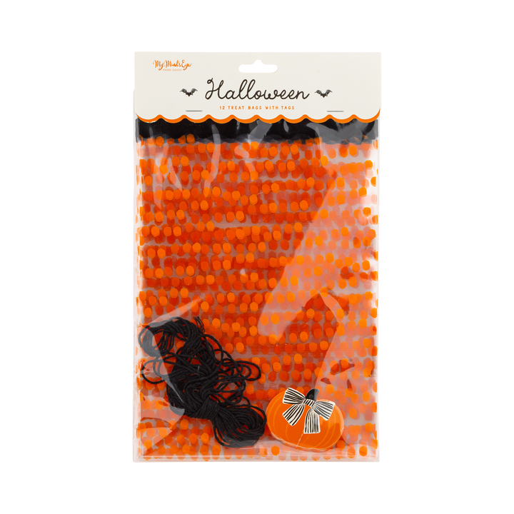 Packaged Halloween-themed treat bags with orange dots, black ties and pumpkin shaped tags on a white background.