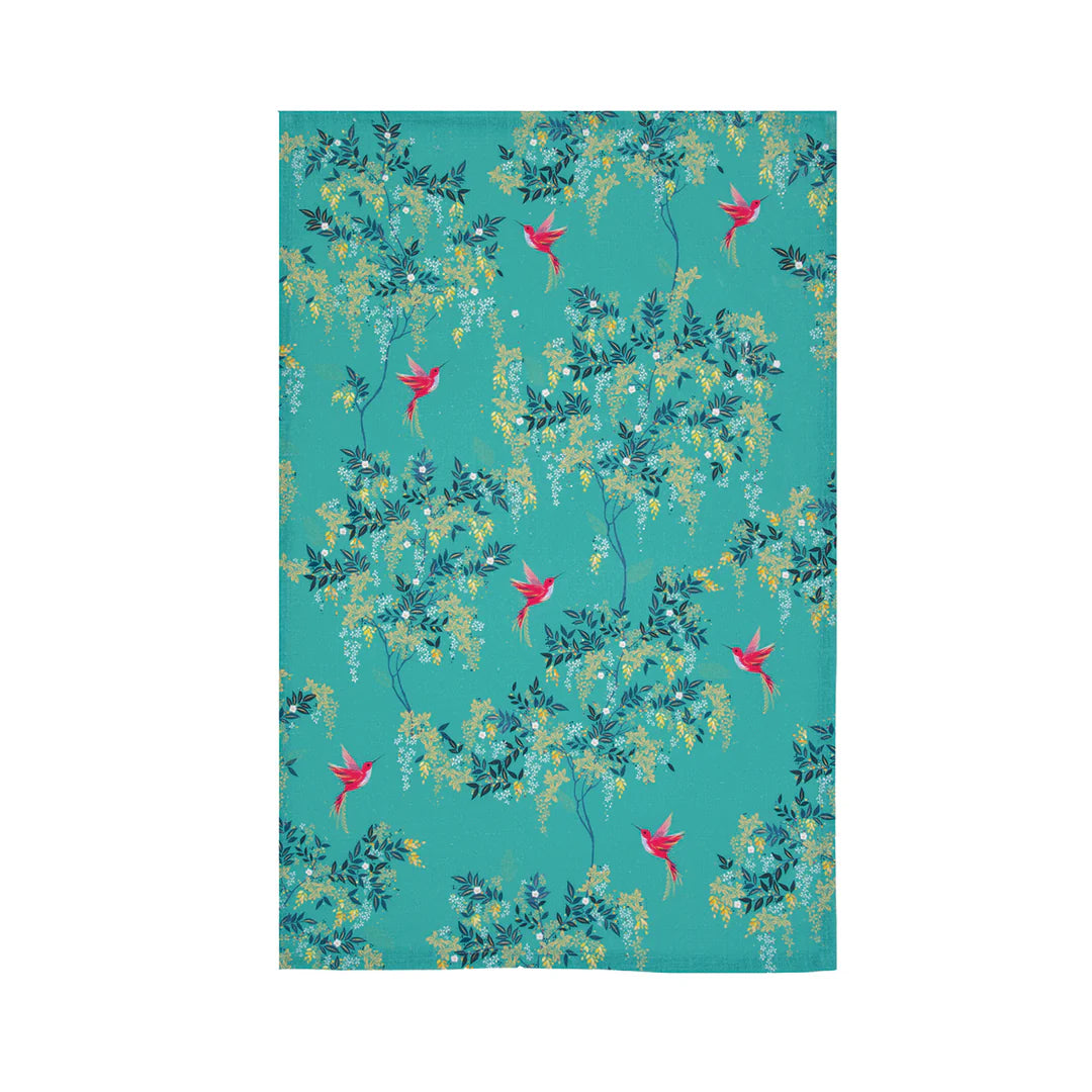 Floral patterned towel with pink flowers and green leaves on a teal background