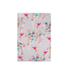 Floral and hummingbird patterned towel on a white background