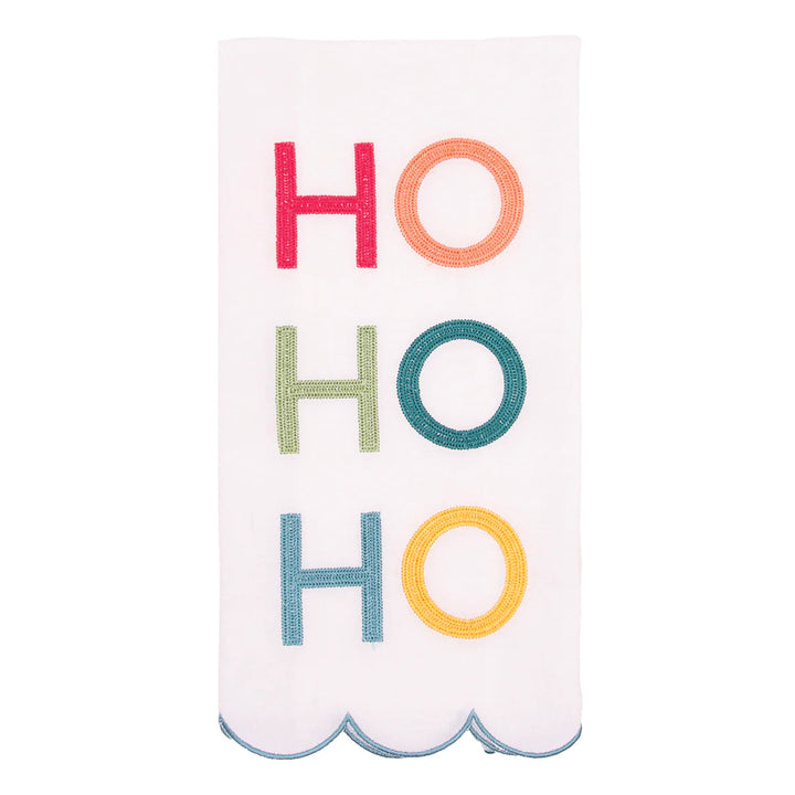 Decorative towel with 'HO HO HO' in colorful letters on a white background