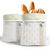 Bread basket with patterned design containing bread loaves on a white background