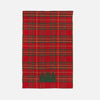 Red plaid towel with green trees on a white background