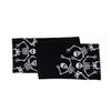 Black table runner with white skeleton patterns on a white background
