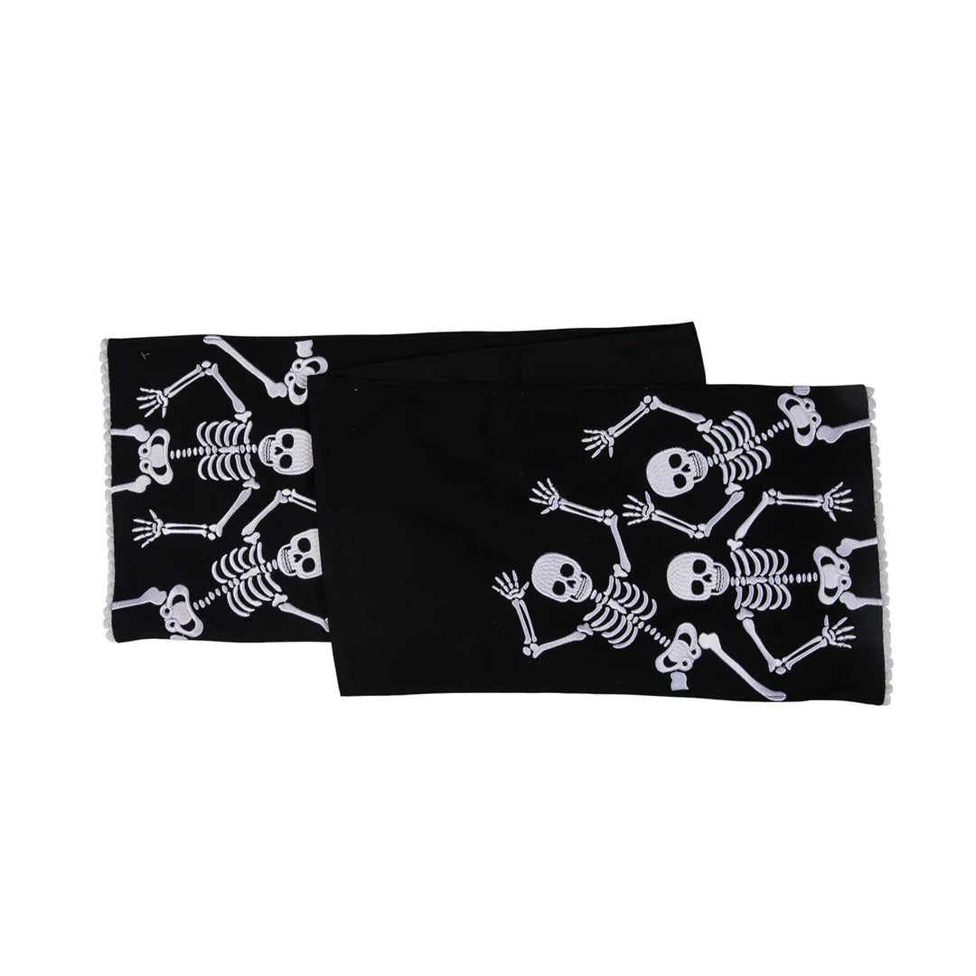 Black table runner with white skeleton patterns on a white background