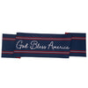Navy blue table runner with 'God Bless America' text and red and white stripes on one side and stars and stripes the other side on a white background