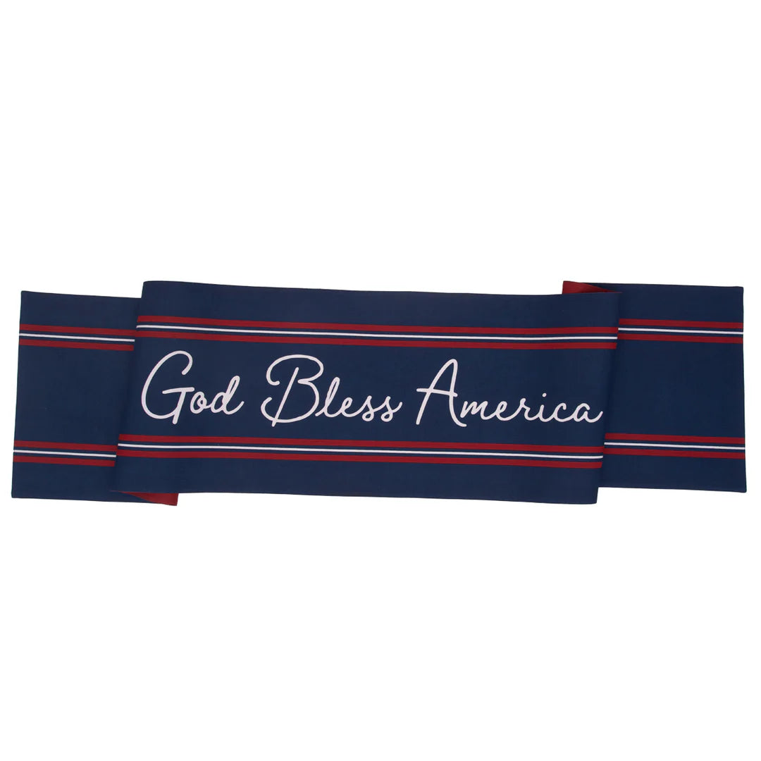 Navy blue table runner with 'God Bless America' text and red and white stripes on one side and stars and stripes the other side on a white background