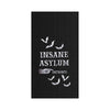 Black textured towel with 'Insane Asylum Entrance' text and bats design on a white background